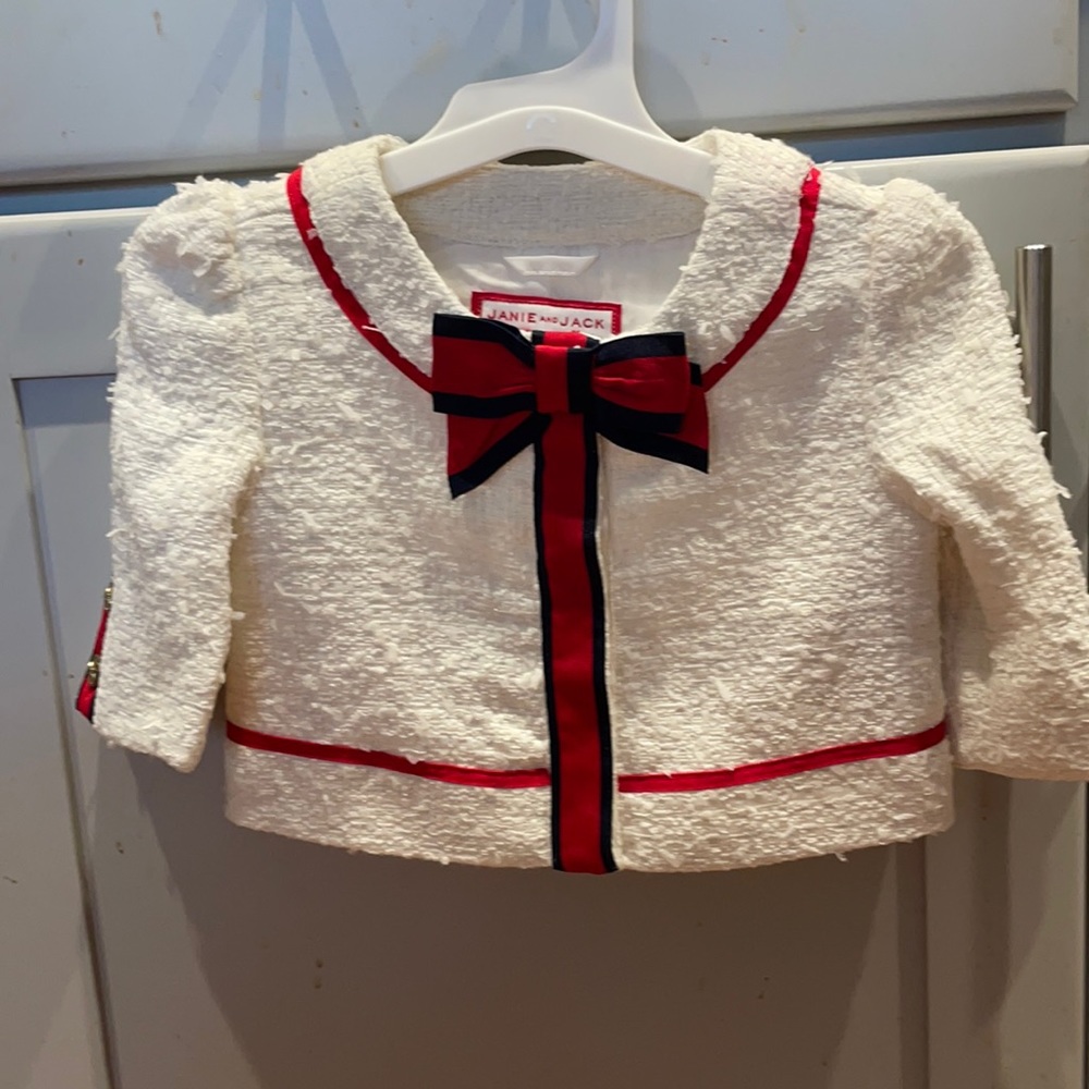Creamy white with red & navy bow